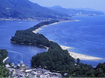 A panoramic view of Amanohashidate, a pine-covered sandbar stretching across the sea, known as one of Japan’s Three Scenic Views.
