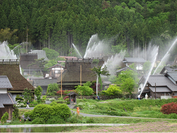 A traditional thatched-roof village in Miyama, surrounded by mountains, preserving Japan’s timeless rural landscape.
